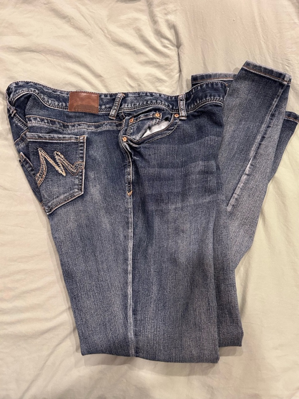 Maurices Dark Blue Skinny Jeans with Embroidered Back Pocket